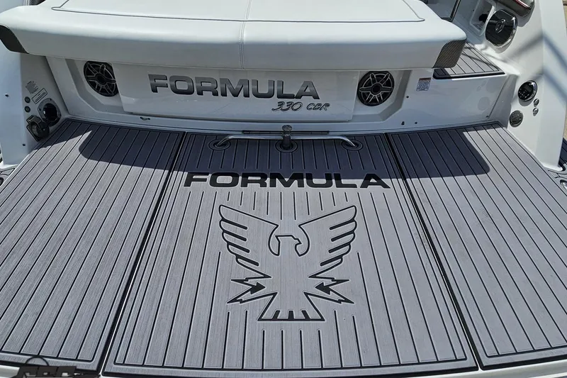 Slide: The Image of 2020 Formula 330 Crossover Bowrider boat deck with logo and eagle emblem. - 35
