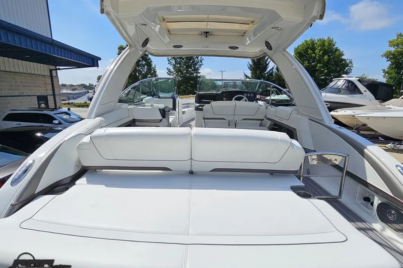 Slide: The Image of 2020 Formula 330 Crossover Bowrider with luxurious white seating and sleek design. - 36