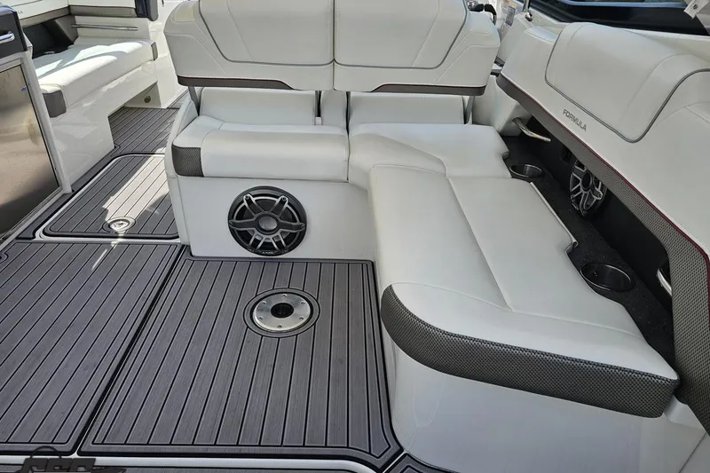 Slide: The Image of 2020 Formula 330 Crossover Bowrider interior with white seating and modern design. - 43
