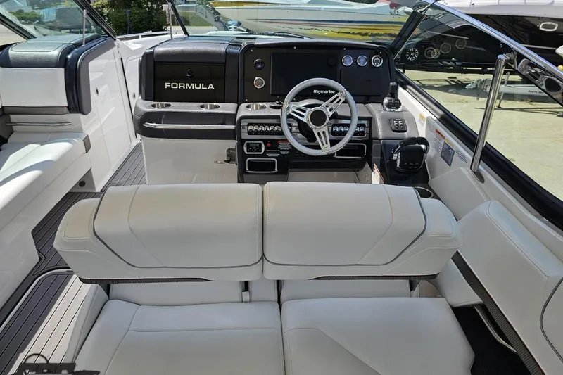 Slide: The Image of 2020 Formula 330 Crossover Bowrider interior with sleek dashboard and comfortable seating. - 53