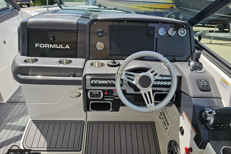 Slide: The Image of 2020 Formula 330 Crossover Bowrider dashboard with steering wheel and control panel. - 59