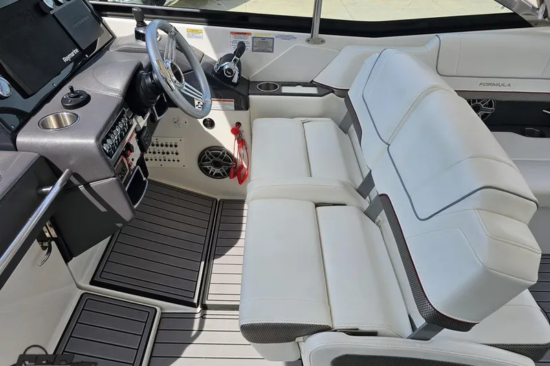 Slide: The Image of 2020 Formula 330 Crossover Bowrider interior with sleek dashboard and comfortable seating. - 63