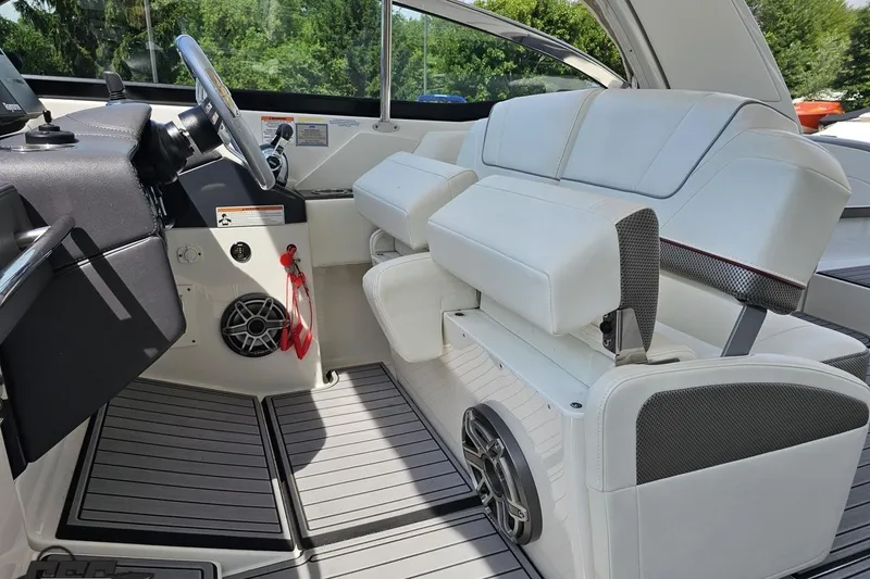 Slide: The Image of 2020 Formula 330 Crossover Bowrider interior with white seating and modern dashboard. - 64