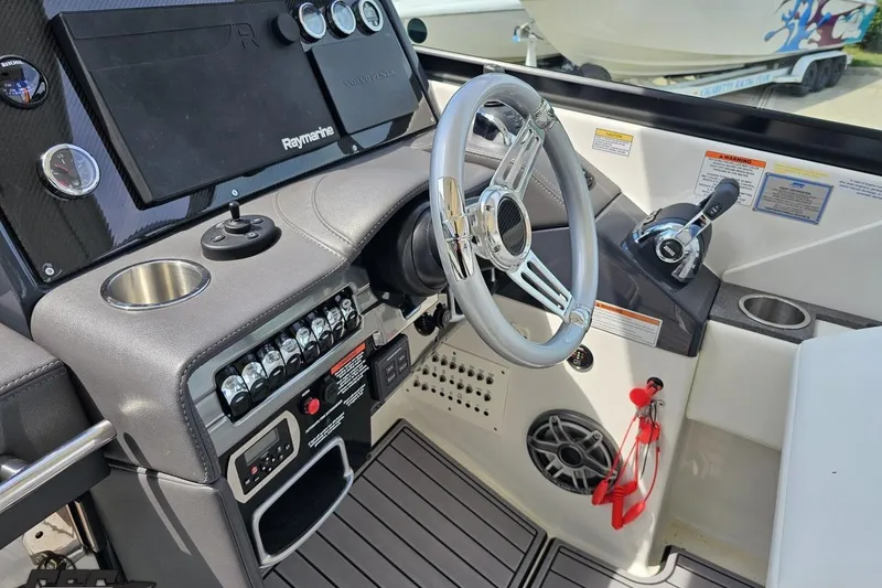 Slide: The Image of 2020 Formula 330 Crossover Bowrider helm with steering wheel and control panel. - 66