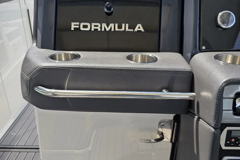 Slide: The Image of 2020 Formula 330 Crossover Bowrider interior with cup holders and sleek design. - 69