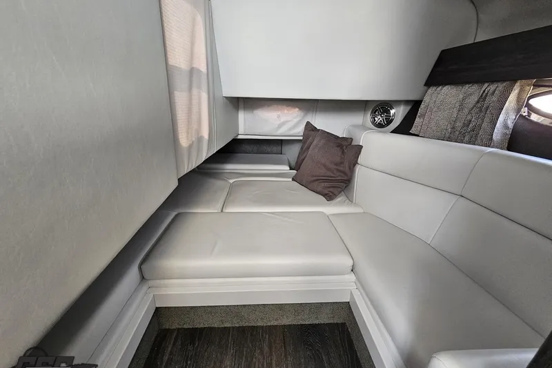 Slide: The Image of 2020 Formula 330 Crossover Bowrider cabin interior with plush seating and cushions. - 73