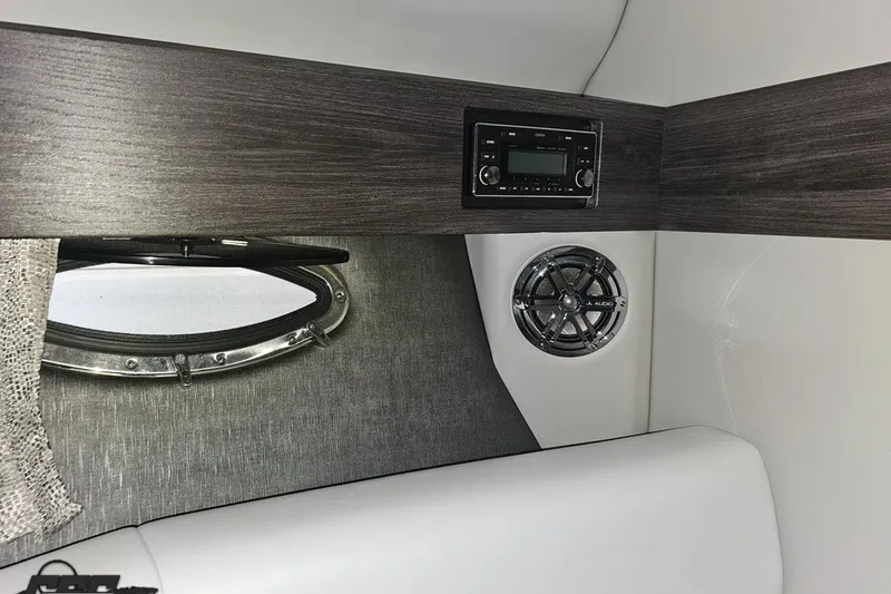 Slide: The Image of 2020 Formula 330 Crossover Bowrider cabin interior with audio system and porthole. - 78