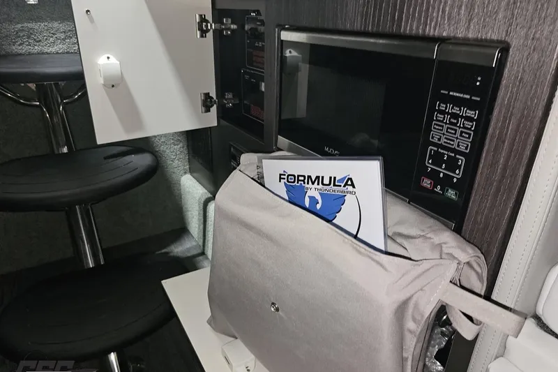 Slide: The Image of Interior of 2020 Formula 330 Crossover Bowrider with microwave and storage. - 83