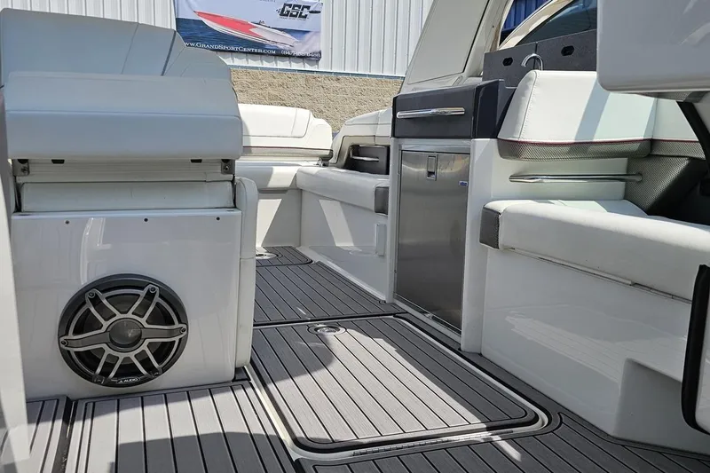 Slide: The Image of 2020 Formula 330 Crossover Bowrider interior with seating, speaker, and sleek flooring. - 84