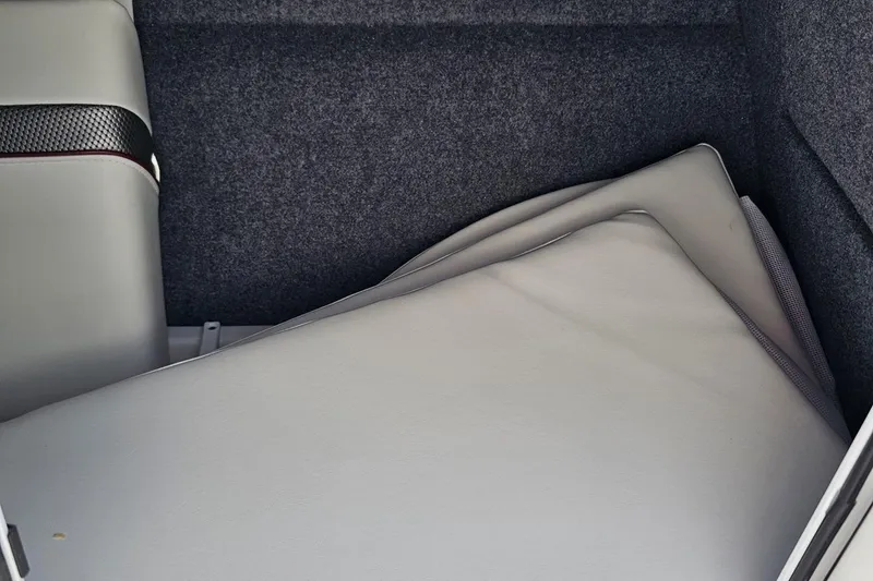 Slide: The Image of Interior storage area of 2020 Formula 330 Crossover Bowrider with cushioned seating. - 90