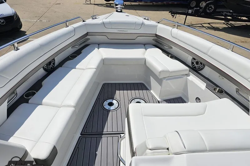 Slide: The Image of 2020 Formula 330 Crossover Bowrider with spacious white seating and sleek design. - 91