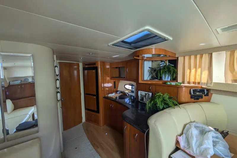 Slide: The Image of Interior of 2004 Carver 360 Mariner yacht with kitchen and seating area. - 16
