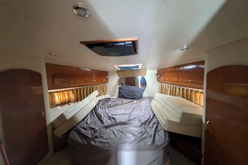 Slide: The Image of Interior cabin of 2004 Carver 360 Mariner yacht with bed and wooden cabinets. - 19