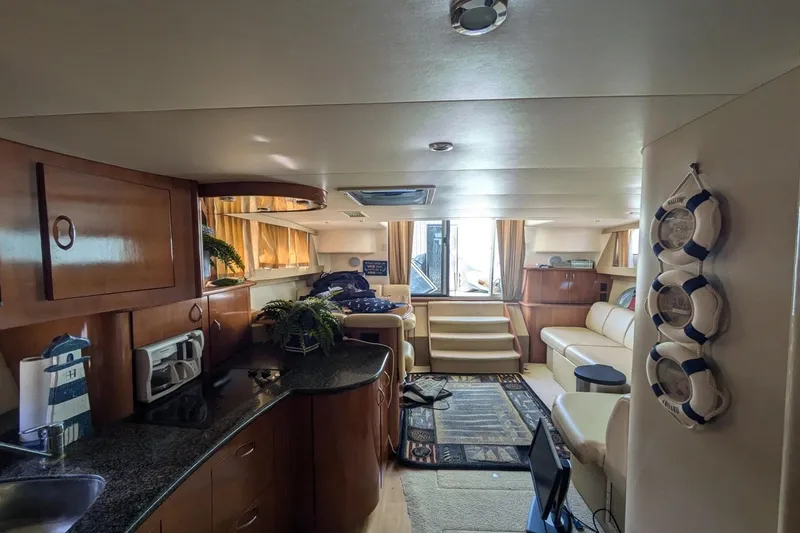 Slide: The Image of 2004 Carver 360 Mariner yacht on dry dock, side view under clear blue sky. - 2