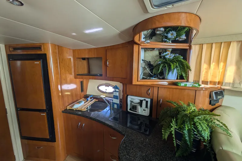 Slide: The Image of Interior of 2004 Carver 360 Mariner yacht with kitchen and plants. - 22