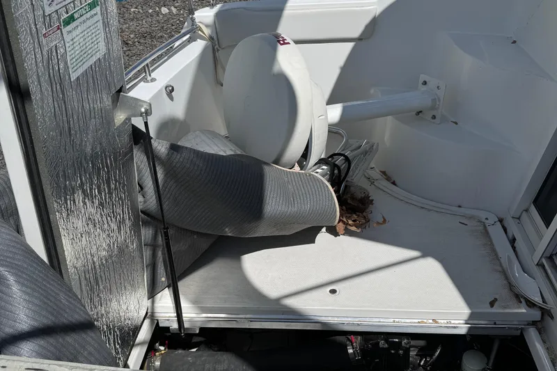 Slide: The Image of 2004 Carver 360 Mariner boat interior with equipment and storage area. - 25