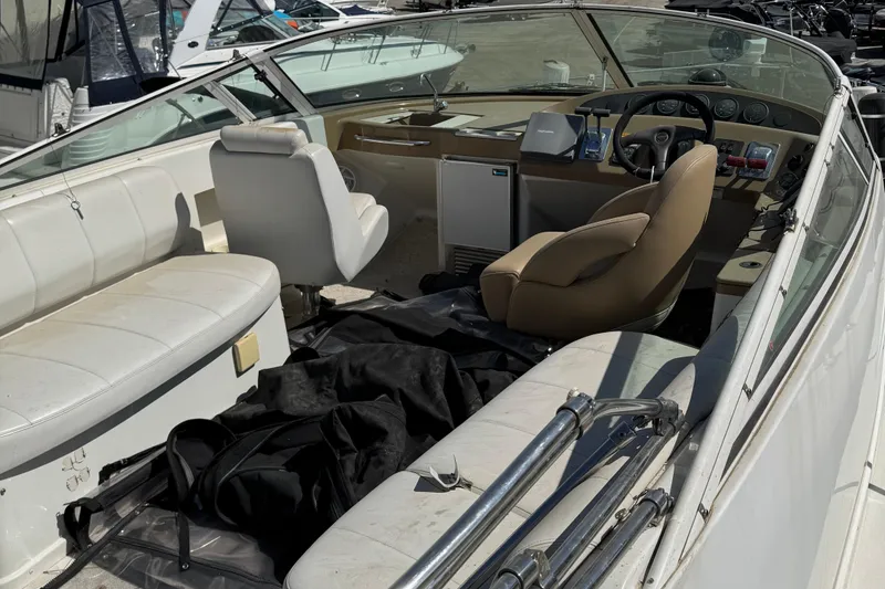 Slide: The Image of 2004 Carver 360 Mariner boat interior with white seating and control panel. - 27