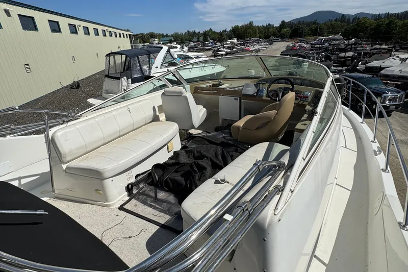Slide: The Image of 2004 Carver 360 Mariner boat with spacious seating and helm, docked outdoors. - 28