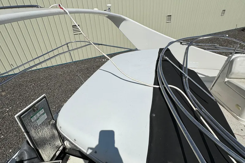 Slide: The Image of 2004 Carver 360 Mariner boat deck with railing and open hatch. - 29