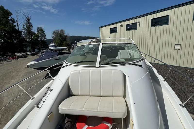 Slide: The Image of 2004 Carver 360 Mariner boat docked, featuring a spacious deck and seating area. - 31