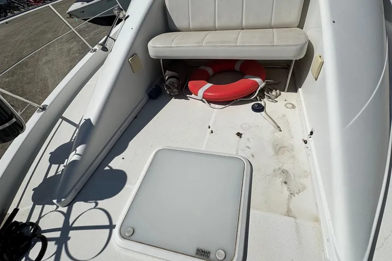 Slide: The Image of 2004 Carver 360 Mariner deck with seating and life preserver. - 32