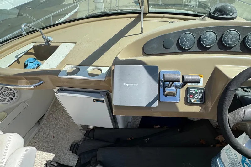 Slide: The Image of 2004 Carver 360 Mariner helm with Raymarine navigation and control panel. - 36