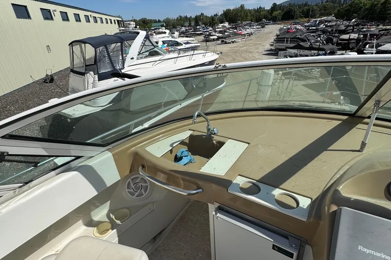 Slide: The Image of 2004 Carver 360 Mariner boat interior with sink and marina view. - 38