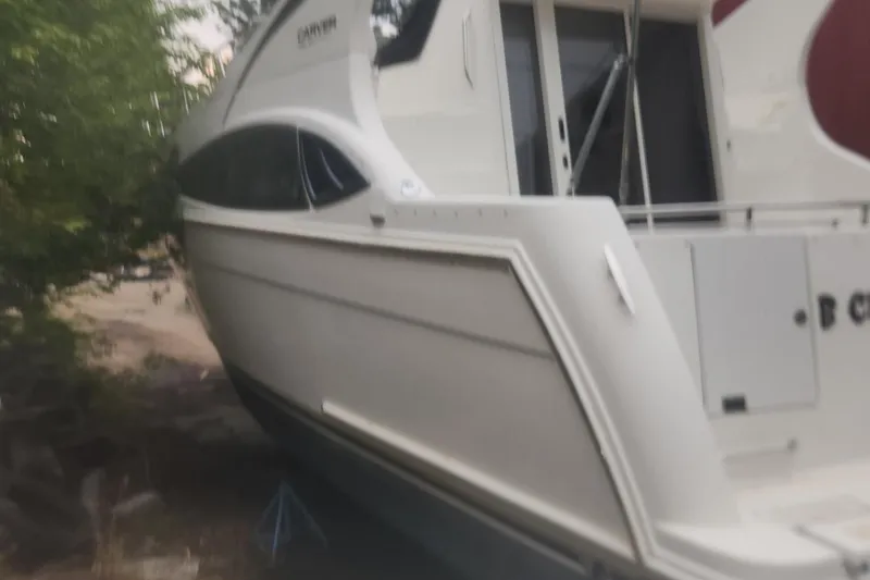 Slide: The Image of 2004 Carver 360 Mariner yacht docked near trees, side view. - 44