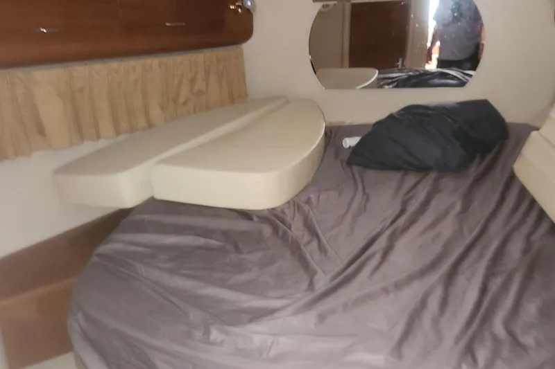 Slide: The Image of Interior cabin of 2004 Carver 360 Mariner with bed and mirror. - 51