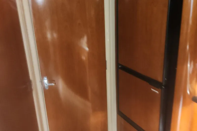 Slide: The Image of Interior view of 2004 Carver 360 Mariner with wooden doors and cabinetry. - 52