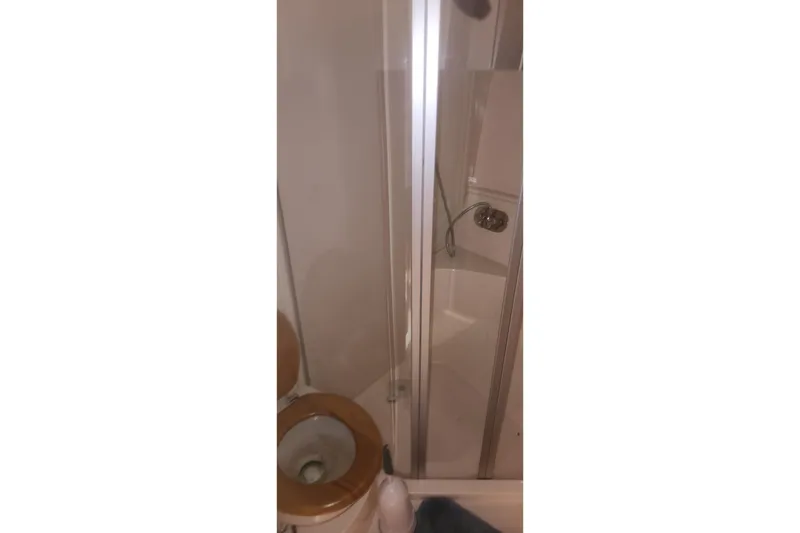 Slide: The Image of Bathroom interior of 2004 Carver 360 Mariner with shower and toilet. - 55