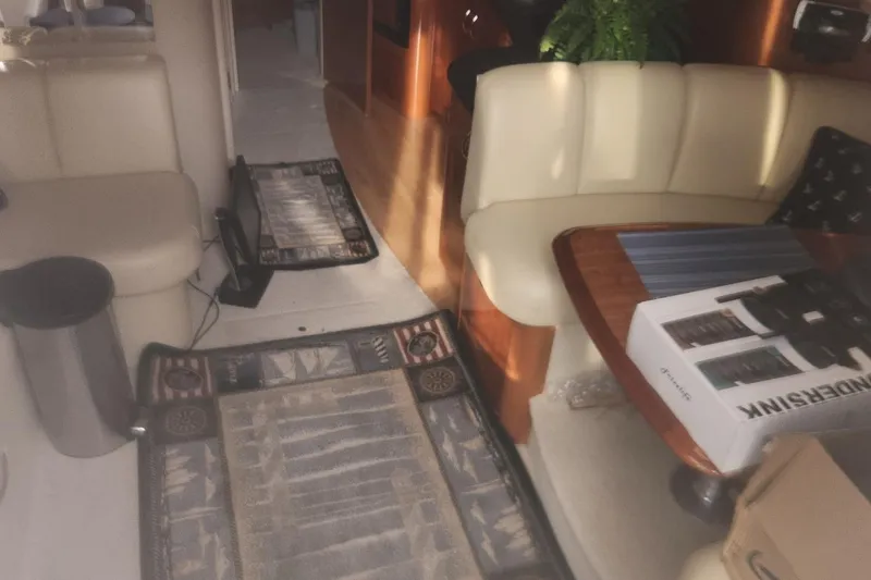 Slide: The Image of Interior of a 2004 Carver 360 Mariner yacht with seating and decor. - 59