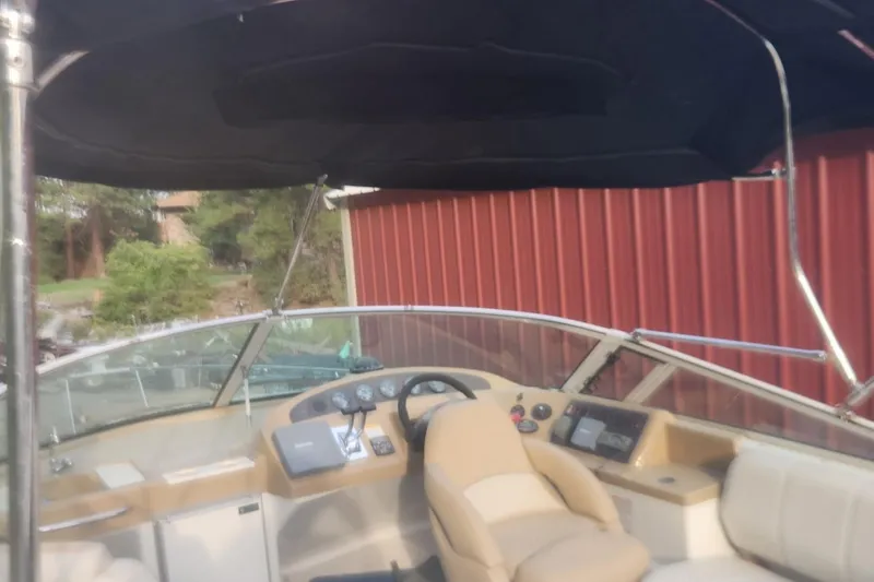 Slide: The Image of 2004 Carver 360 Mariner boat interior with steering console and seating. - 65
