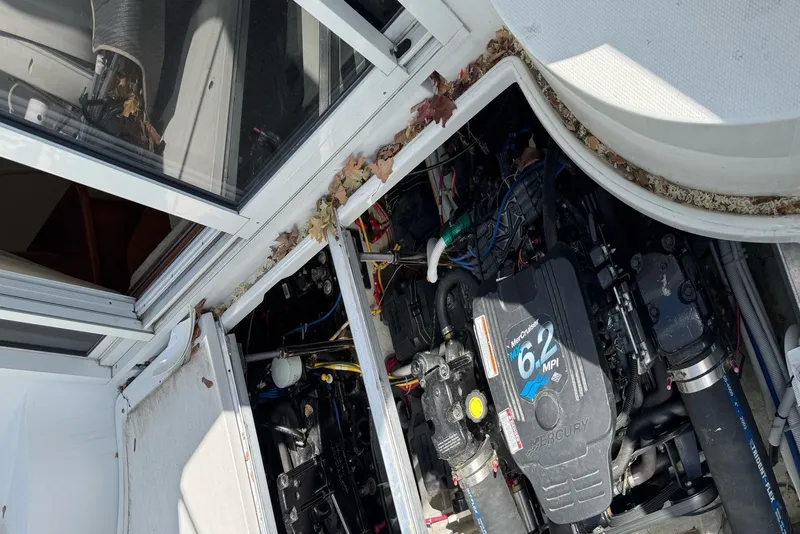 Slide: The Image of 2004 Carver 360 Mariner yacht on dry land near a building under a clear sky. - 7