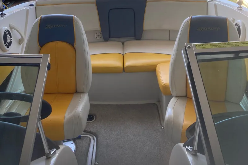 Slide: The Image of Interior of a 2007 Sea Ray 195 Sport boat with yellow and gray seating. - 12