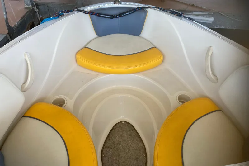 Slide: The Image of 2007 Sea Ray 195 Sport boat interior with yellow and gray seating. - 8