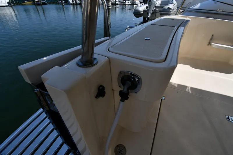 Slide: The Image of 2006 Mainship 40 Trawler deck with water connection and storage compartment. - 18