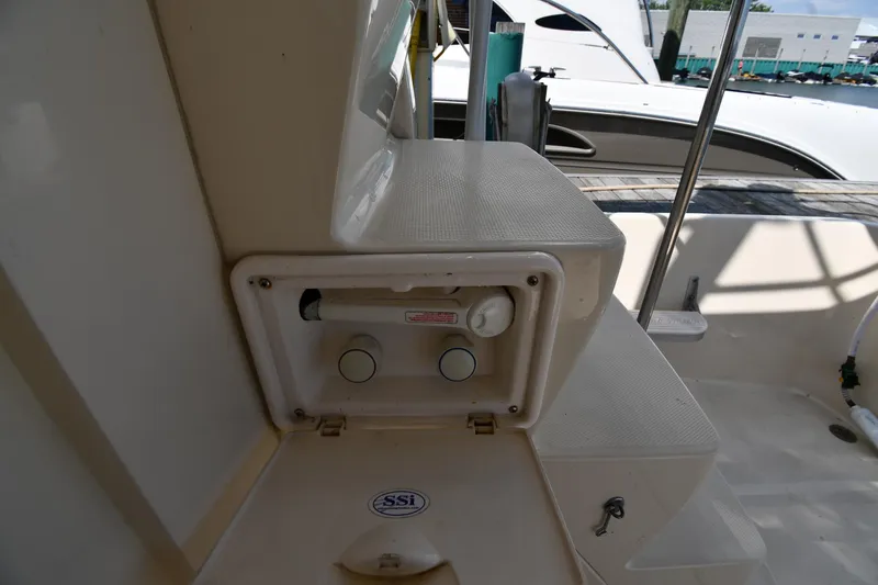 Slide: The Image of 2006 Mainship 40 Trawler deck with storage compartment and marine equipment. - 19