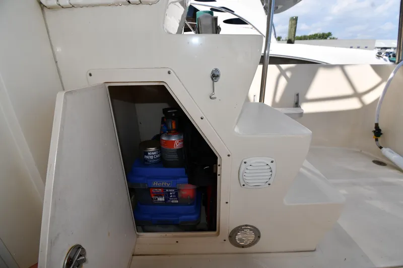 Slide: The Image of Storage compartment on 2006 Mainship 40 Trawler, containing various supplies and equipment. - 20
