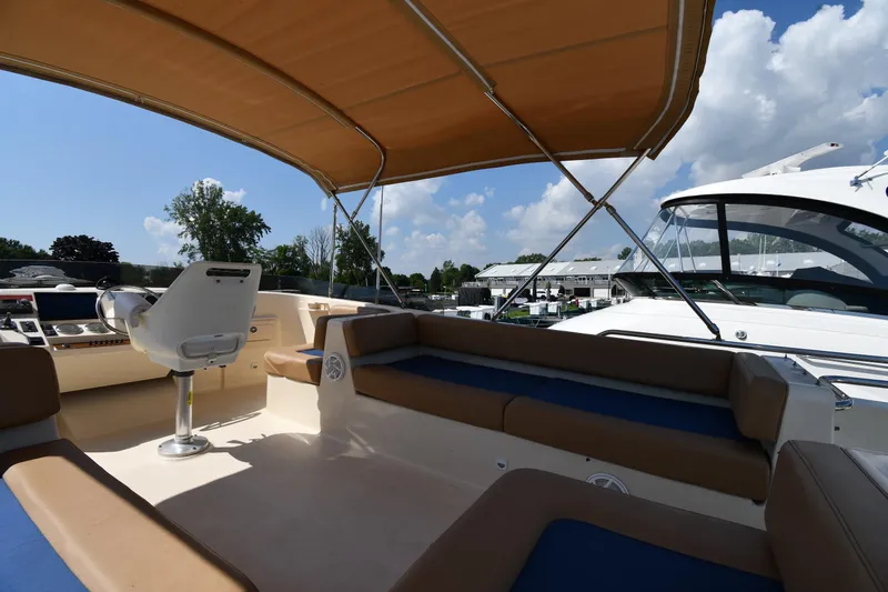 Slide: The Image of 2006 Mainship 40 Trawler interior with seating and helm under canopy. - 27