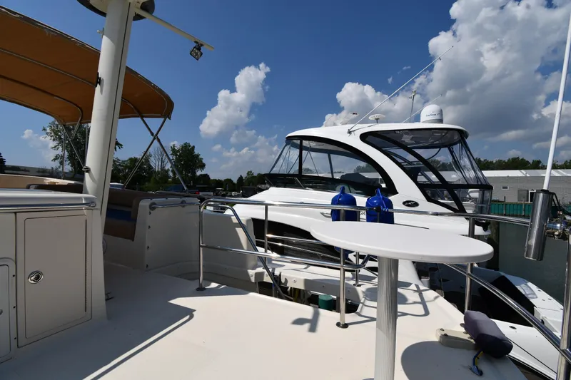 Slide: The Image of 2006 Mainship 40 Trawler on sunny day, docked with clear sky background. - 31