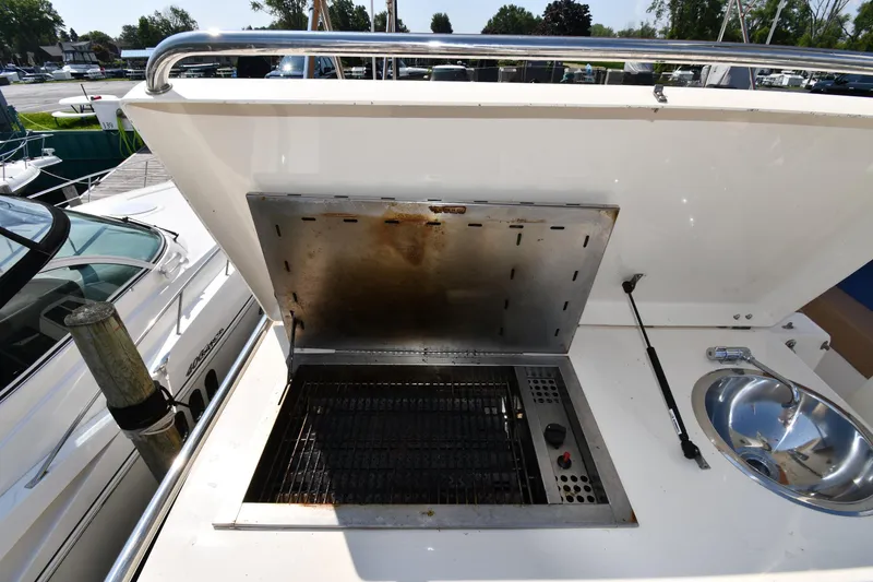 Slide: The Image of Outdoor grill and sink on 2006 Mainship 40 Trawler yacht deck. - 34