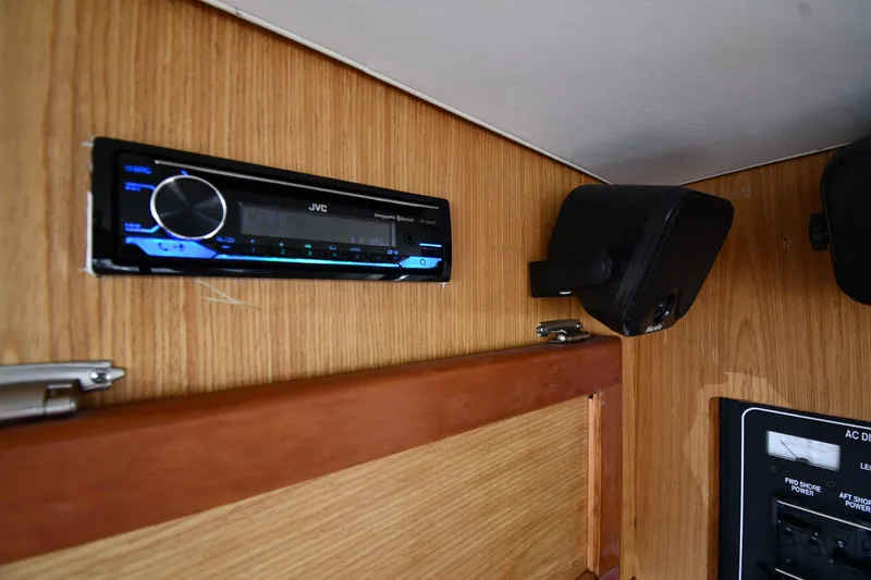Slide: The Image of 2006 Mainship 40 Trawler interior with JVC stereo and speaker system. - 69