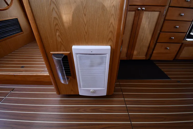 Slide: The Image of Wooden interior of 2006 Mainship 40 Trawler with vent and cabinetry. - 71