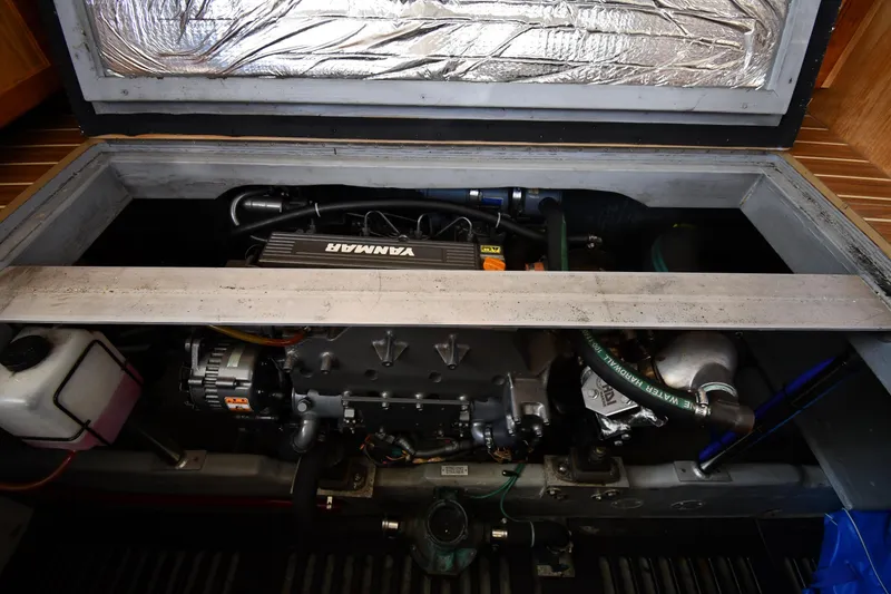Slide: The Image of Engine compartment of a 2006 Mainship 40 Trawler, featuring a Yanmar engine. - 74