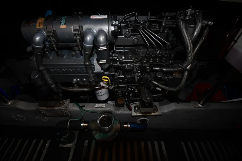 Slide: The Image of Engine compartment of a 2006 Mainship 40 Trawler, showcasing intricate mechanical components. - 75