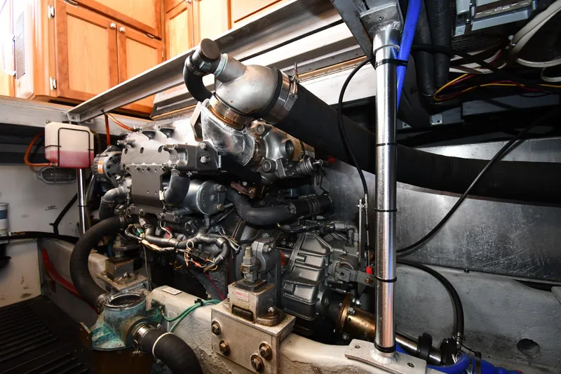 Slide: The Image of Engine room of 2006 Mainship 40 Trawler, showcasing detailed mechanical components. - 76