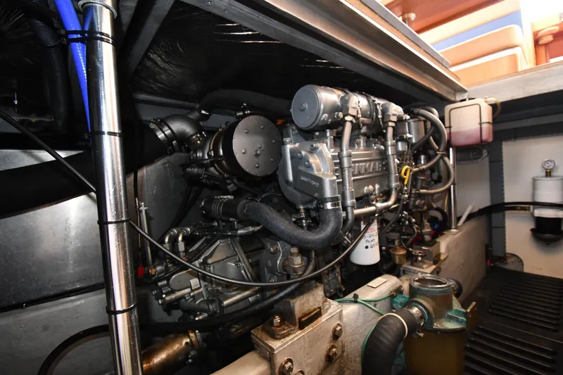 Slide: The Image of Engine room of 2006 Mainship 40 Trawler, showcasing detailed mechanical components. - 77