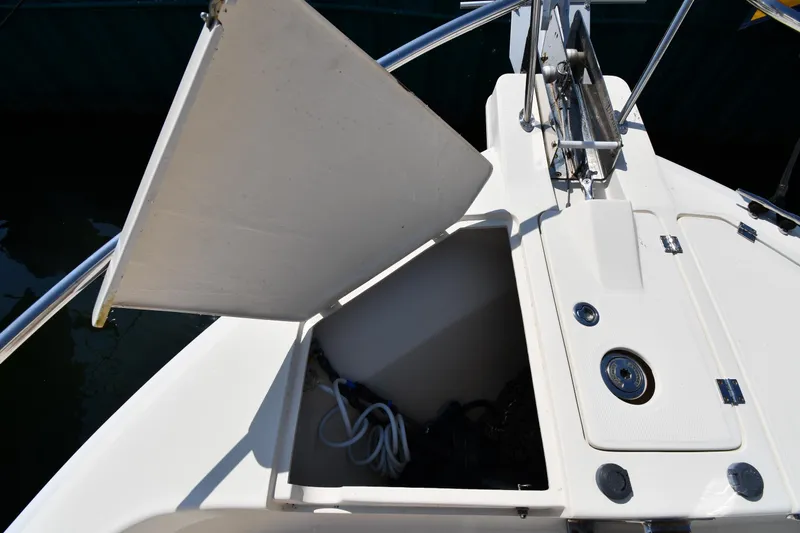 Slide: The Image of Open storage compartment on 2006 Mainship 40 Trawler boat deck. - 8