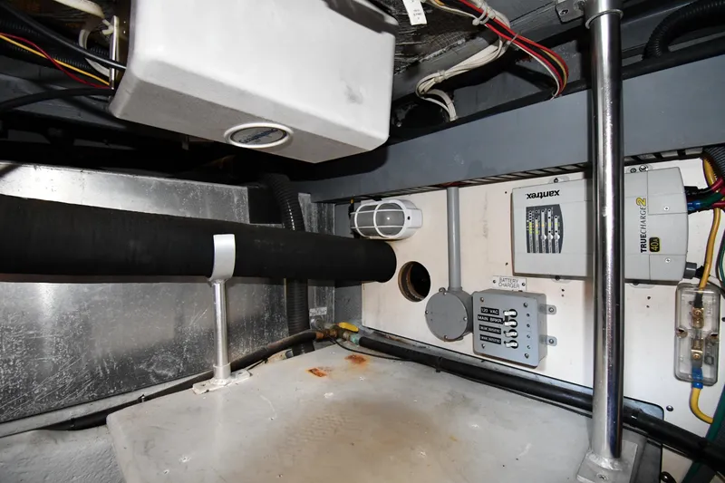 Slide: The Image of Engine room of 2006 Mainship 40 Trawler with electrical components and wiring. - 81